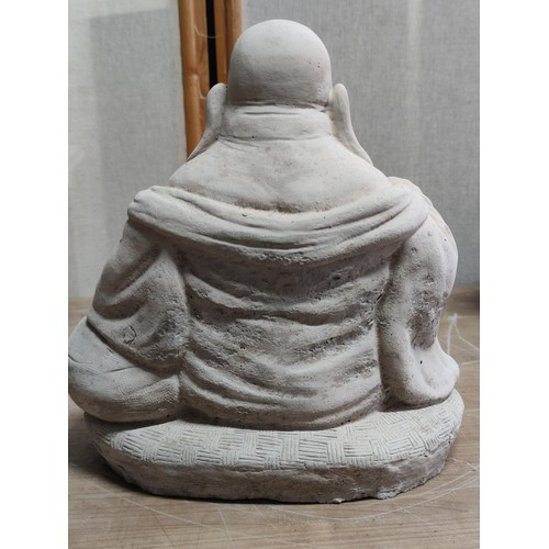 370 - Large concrete buddha figure with good detailing stands at 28cm high, 28cm long, 20cm deep