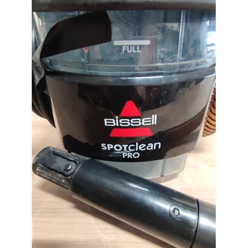 381 - A Bissell spot clean pro complete with hose, extensions and power cable.