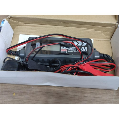 386 - A box of items inc a battery charger, as new Panasonic car cd player/radio CQ-RDP113N,  pair of spot... 