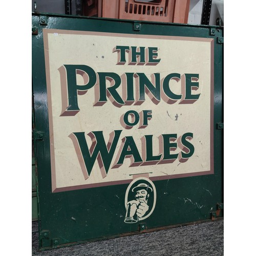 389 - A large metal double sided Prince of Wales pub sign in a wrought iron frame with hanging holes to th... 