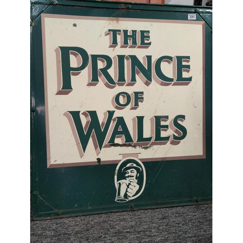 390 - A large metal double sided Prince of Wales pub sign in a wrought iron frame with hanging hooks to th... 