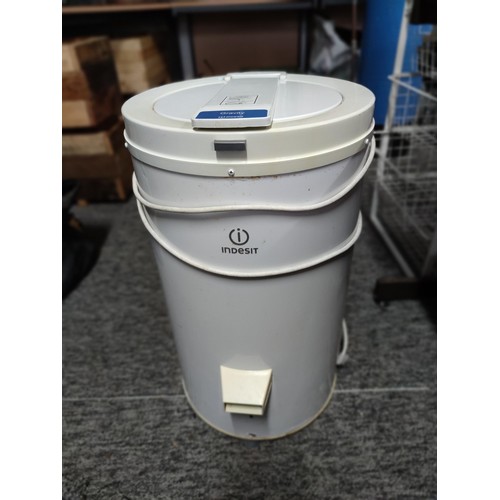 395 - An Indesit IPX4 Gravity spin dryer, complete with power cable and plastic clothes cover, stands at 6... 