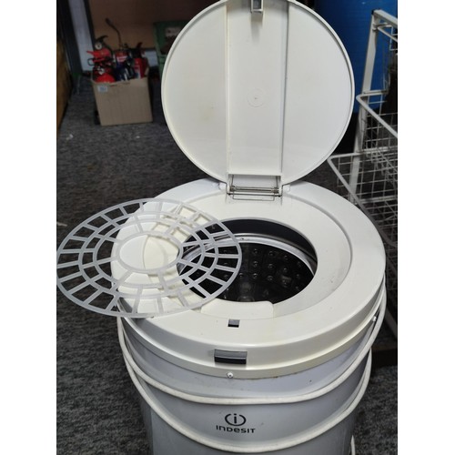 395 - An Indesit IPX4 Gravity spin dryer, complete with power cable and plastic clothes cover, stands at 6... 