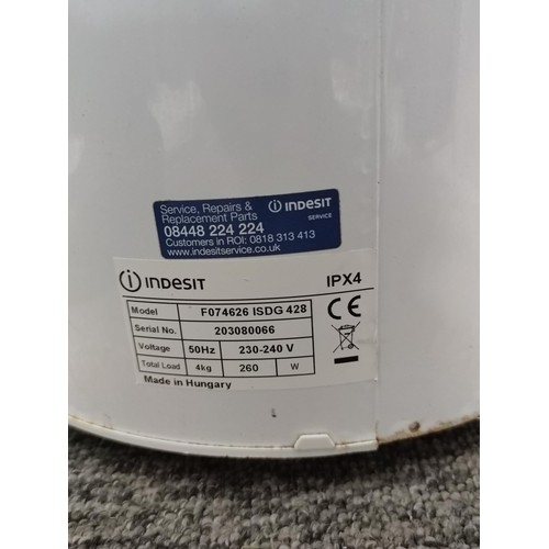 395 - An Indesit IPX4 Gravity spin dryer, complete with power cable and plastic clothes cover, stands at 6... 