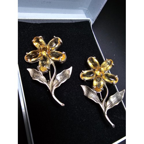 203 - 2x matching 925 silver flower brooches of good quality, both inset with faceted genuine citrine gems... 