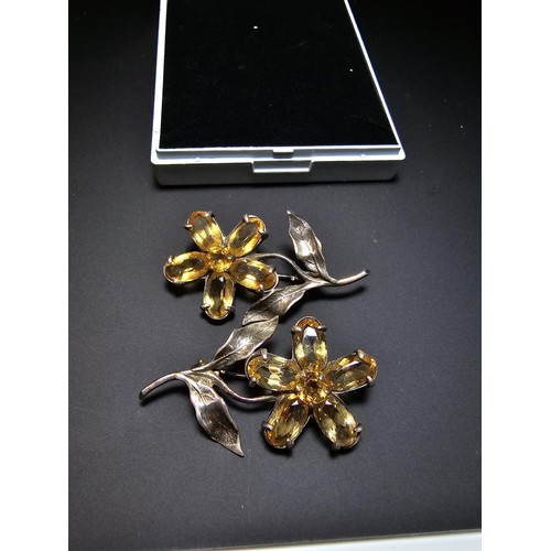 203 - 2x matching 925 silver flower brooches of good quality, both inset with faceted genuine citrine gems... 