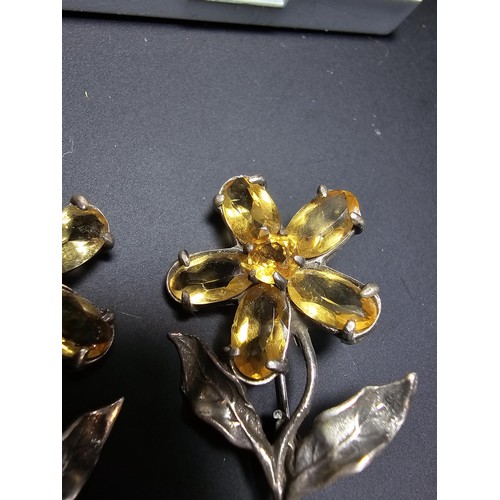 203 - 2x matching 925 silver flower brooches of good quality, both inset with faceted genuine citrine gems... 