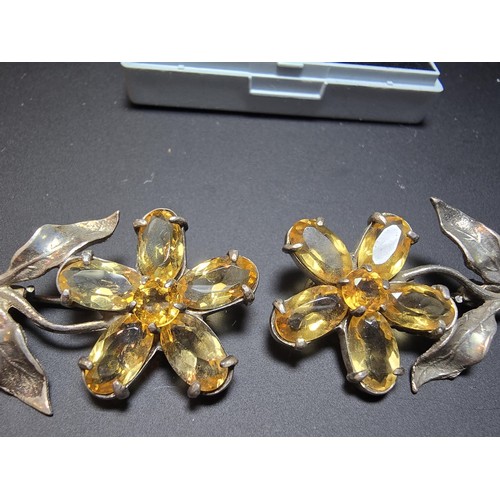 203 - 2x matching 925 silver flower brooches of good quality, both inset with faceted genuine citrine gems... 