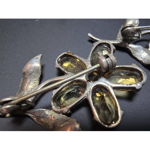 203 - 2x matching 925 silver flower brooches of good quality, both inset with faceted genuine citrine gems... 