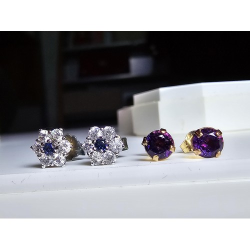 209 - 2 pairs of stud earrings to include a pair of 9ct gold stud earrings inset with amethyst stones alon... 