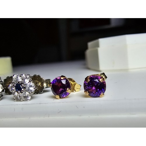 209 - 2 pairs of stud earrings to include a pair of 9ct gold stud earrings inset with amethyst stones alon... 