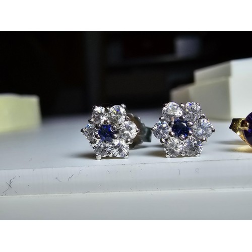 209 - 2 pairs of stud earrings to include a pair of 9ct gold stud earrings inset with amethyst stones alon... 