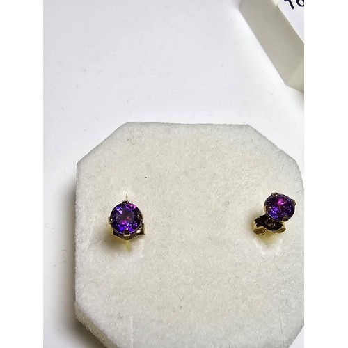 209 - 2 pairs of stud earrings to include a pair of 9ct gold stud earrings inset with amethyst stones alon... 