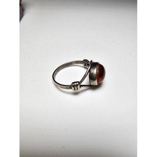 213 - A vintage 925 silver ring inset with a large oval genuine amber stone, in clean condition and boxed.... 