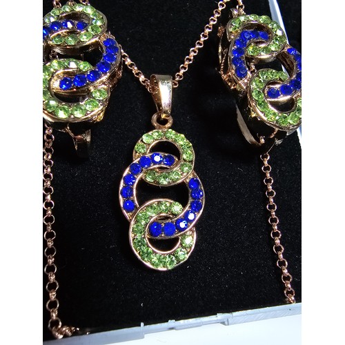 220 - 2x rose gold plated matching jewellery set to include a necklace and earring set inset with blue and... 