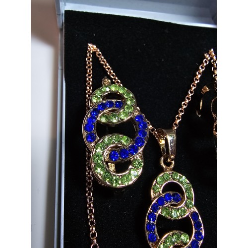 220 - 2x rose gold plated matching jewellery set to include a necklace and earring set inset with blue and... 