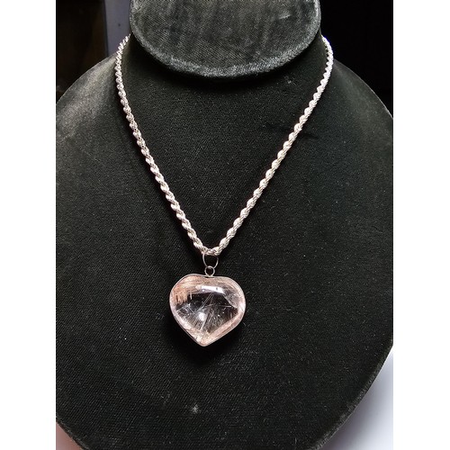 228 - An impressive 925 silver rutilated quartz heart formed pendant set on a good chunky 20