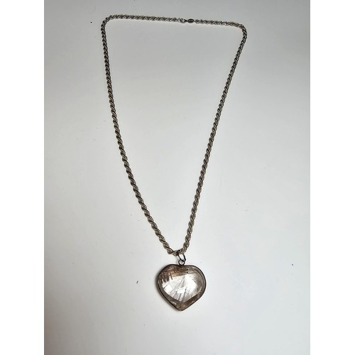 228 - An impressive 925 silver rutilated quartz heart formed pendant set on a good chunky 20