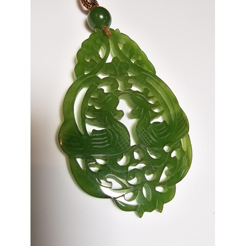 230A - A vintage impressive large carved genuine jade pendant with a cockerel scene, displays well on a lon... 