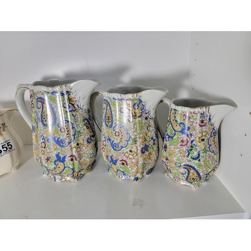 355 - 3 x Graduated jugs 1930's by Alfred Meakin Marigold marquis and 3 further graduated jugs un signed