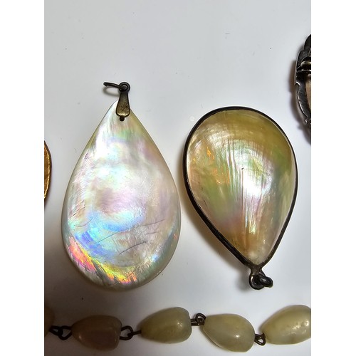 232 - A collection of good quality mother of pearl jewellery to include 3 good mother of pearl pendants wi... 