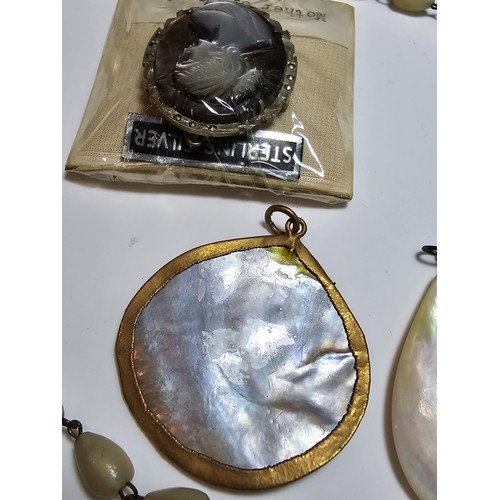 232 - A collection of good quality mother of pearl jewellery to include 3 good mother of pearl pendants wi... 