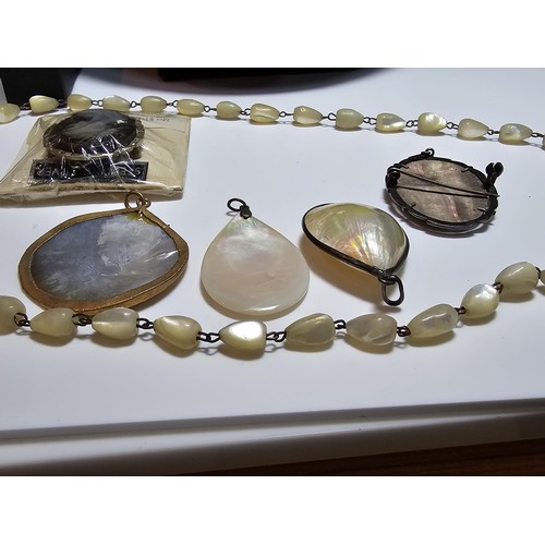 232 - A collection of good quality mother of pearl jewellery to include 3 good mother of pearl pendants wi... 