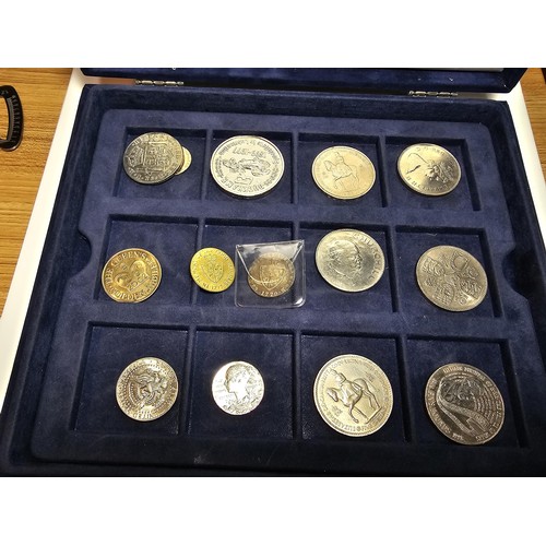 233 - The historic coins of Great Britain case containing a quantity of coins to include a £5 coin along w... 