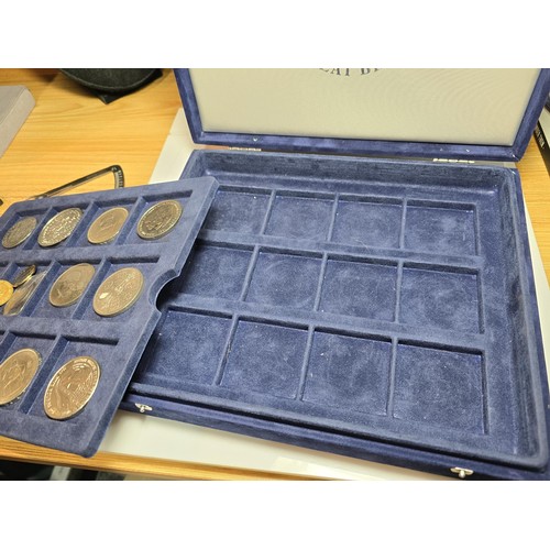 233 - The historic coins of Great Britain case containing a quantity of coins to include a £5 coin along w... 