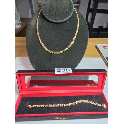 236 - A Carlo Orsini gold plated necklace and bracelet set in as new unused condition and complete with it... 