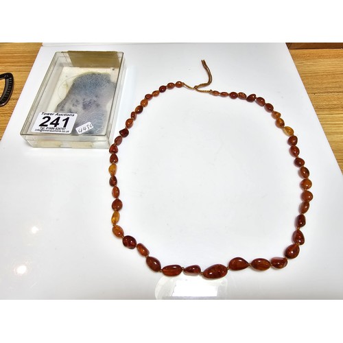 241 - A good quality vintage hand knotted genuine amber beaded necklace, each bead has an interesting natu... 