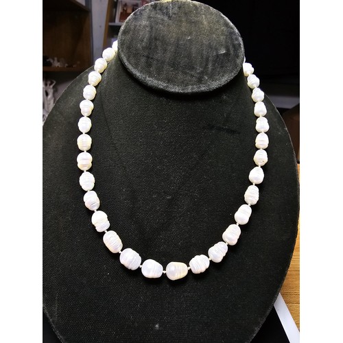 243 - A large collection of pearl jewellery to include a good genuine pearl necklace with a 925 silver cla... 