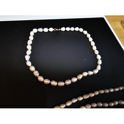 243 - A large collection of pearl jewellery to include a good genuine pearl necklace with a 925 silver cla... 