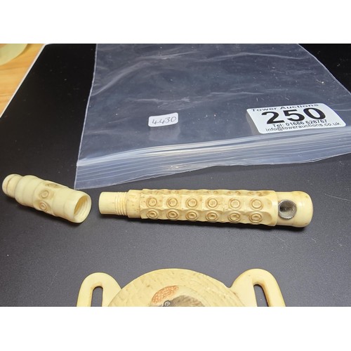 250 - 3x antique carved solid bone items to include a well carved bone buckle with a crane design, a carve... 