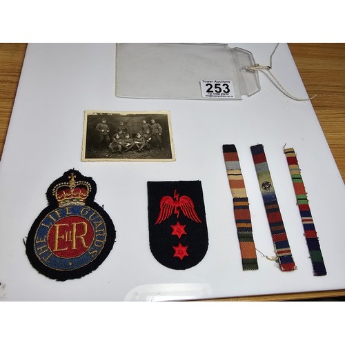 253 - A small quantity of military items to include 2 embroidered patches to include a Lifeguards patch an... 