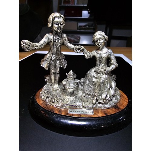 254 - An Italian silver plated figure group of a gentleman and a lady having tea by Ciro Senatore in good ... 