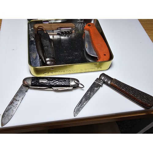 256 - A tin full of 7 good vintage penknives to include a military WWII jackknife dated 1939, a C.Johnson,... 