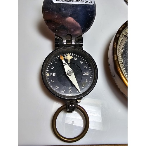 257 - A collection of 3 vintage compasses along with a bolt meter gauge to include a military compass, a l... 