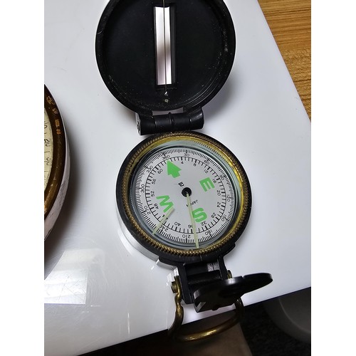 257 - A collection of 3 vintage compasses along with a bolt meter gauge to include a military compass, a l... 