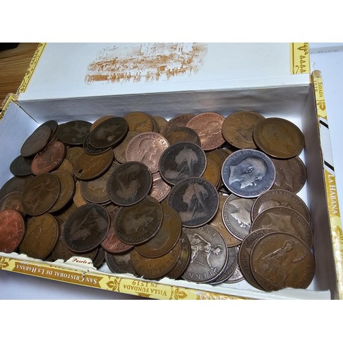 260 - A cigar box containing a large quantity of antique and vintage British copper pennies.