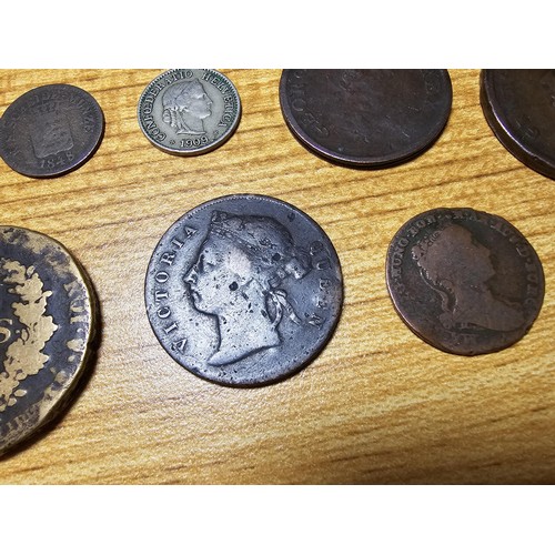 263 - A very large quantity of various vintage and antique world coins in a metal tin, all unsorted and do... 