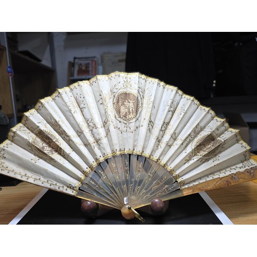 278 - A good antique folding fan in good looked after condition along with a hallmarked silver handle shoe... 