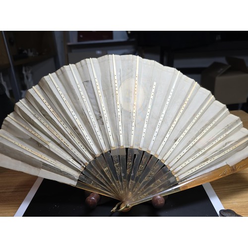 278 - A good antique folding fan in good looked after condition along with a hallmarked silver handle shoe... 