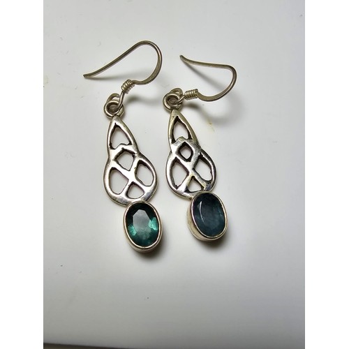 286 - A pair of 925 silver drop earrings inset with rare moldavite faceted gemstones. Moldavite is formed ... 