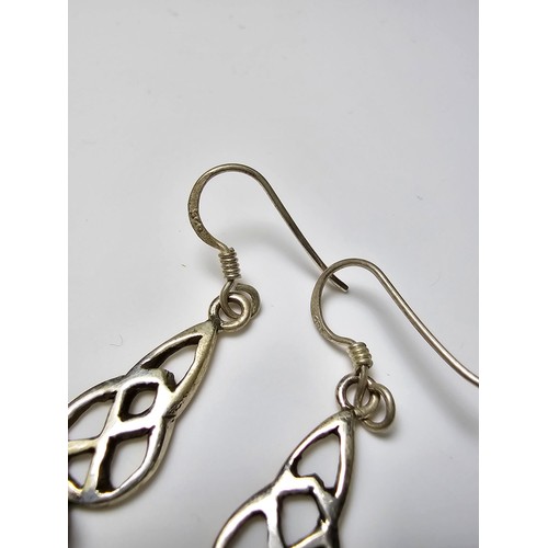 286 - A pair of 925 silver drop earrings inset with rare moldavite faceted gemstones. Moldavite is formed ... 