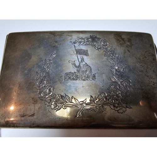 291 - A large solid silver shaped cigarette case featuring an engraved middle eastern design to the top fe... 