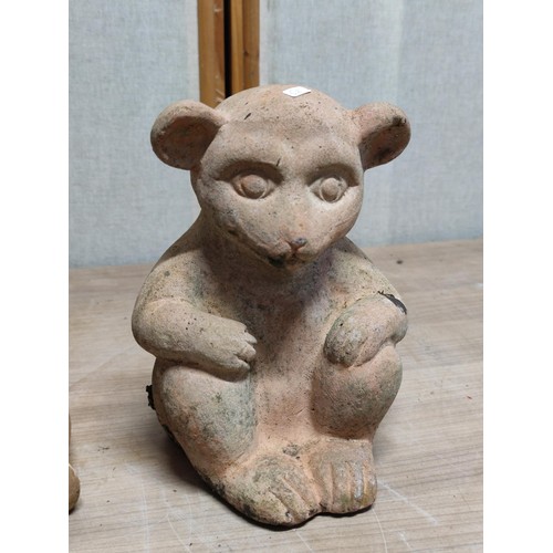 406 - A pair of weathered terracotta Meerkats both sitting down, tallest stands at 28cm high