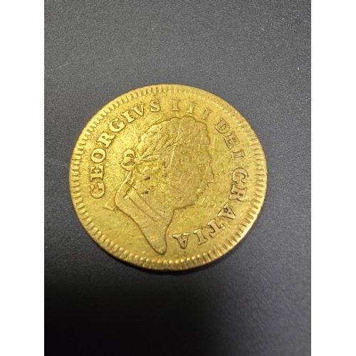 297 - An antique solid gold third guinea coin, George III, dated 1803, in good antique condition. Coin has... 