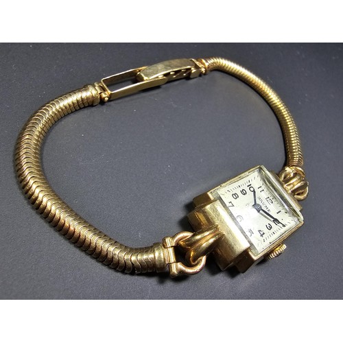 299 - A good quality vintage hallmarked 9ct yellow gold ladies wristwatch by Baume, the case and the strap... 