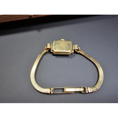 299 - A good quality vintage hallmarked 9ct yellow gold ladies wristwatch by Baume, the case and the strap... 